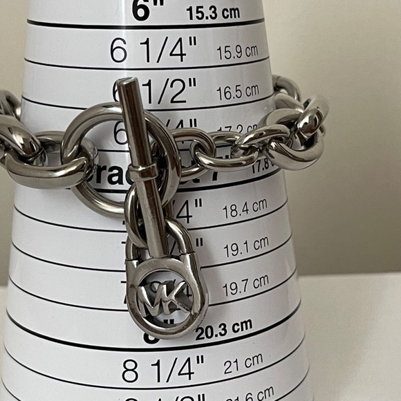 Michael Kors Polished Silver Tone MK Logo-Lock Bracelet. - Picture 5 of 6